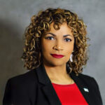Headshot of April Sims, our 2025 Changemakers emcee