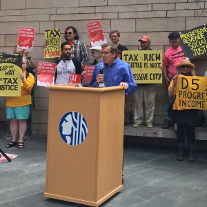 John Burbank emceeing the pre-vote rally.