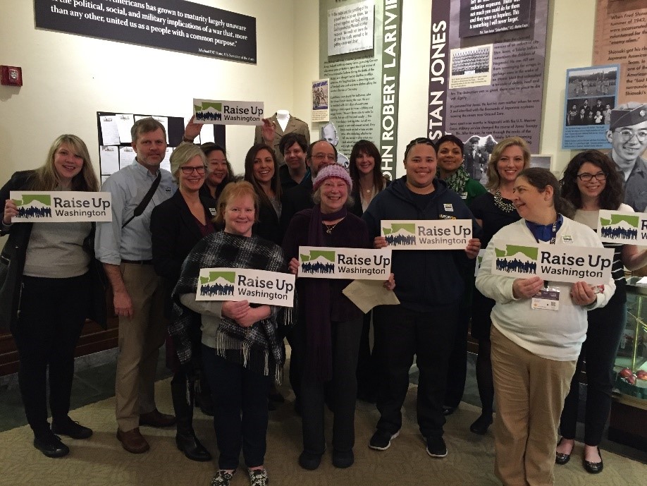 Labor and community advocates gather in Washington’s Secretary of State office to file Initiative 1433, which would raise the state minimum wage and establish paid sick and safe leave standards statewide, January 2016.