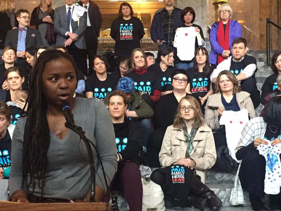 Small business owner Makini Howell speaks at Coalition and legislator press conference inside the Capitol building introducing paid family and medical leave bills, January 2017. 