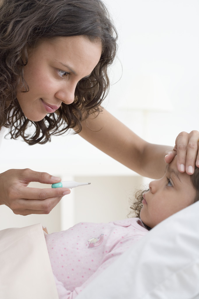 Mother Taking Daughter's Temperature